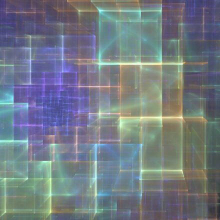 Digitally generated image of cube shapes in green, soft yellow, and purple hues against a darker background.