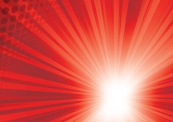 White light source in lower right corner emanates rays of light against a red background with hints of black circles in the upper left corner.