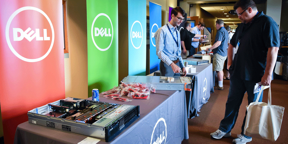 man looking at displays at a Dell conference