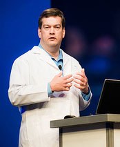 Dell's Forrest Norrod speaking at Dell World wearing a white lab coat