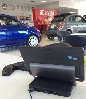 Dell tablet docked at desk in Fiat of Austin showroom