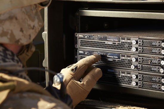 Military personnel looking at Dell PowerEdge R420xr servers in a rack