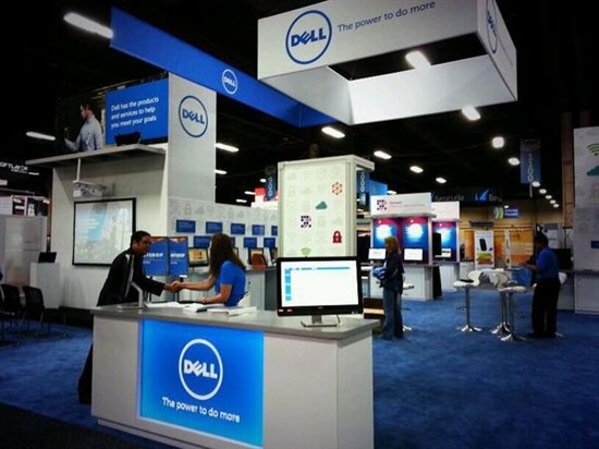 Woman and man shaking hands at Dell booth during Interop 2014