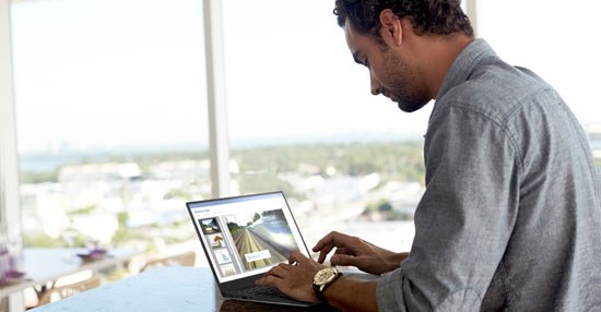 Man typing on Dell XPS 13 laptop
