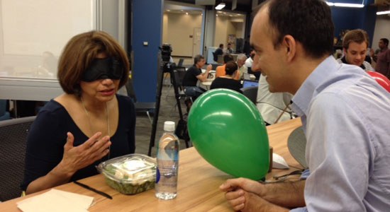  Francesco Tuzzolino laughs with a blindfolded Dell Dine in the Dark participant