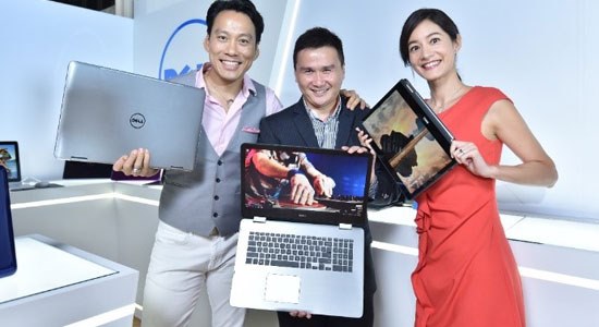  Dell team members at Computex 2016 hold the new Dell Inspiron laptops and 2-in-1s