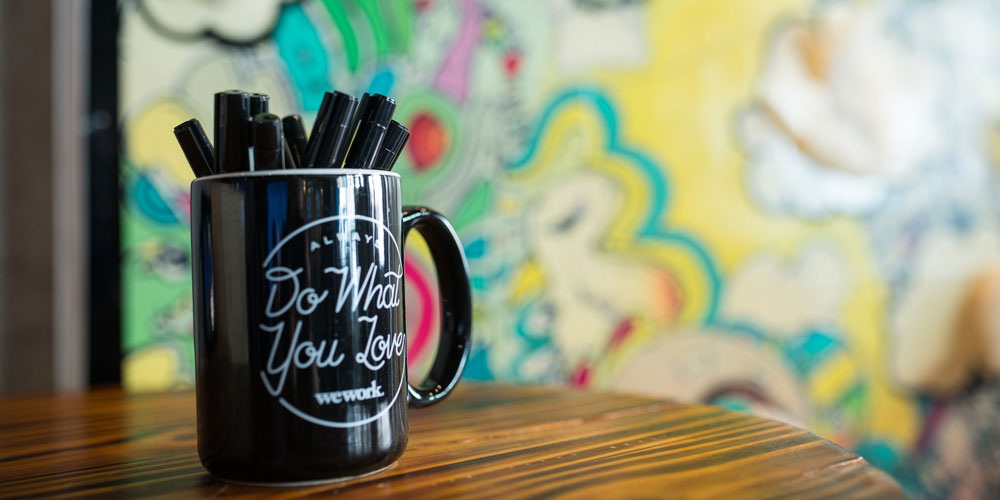 coffee mug with WeWork logo