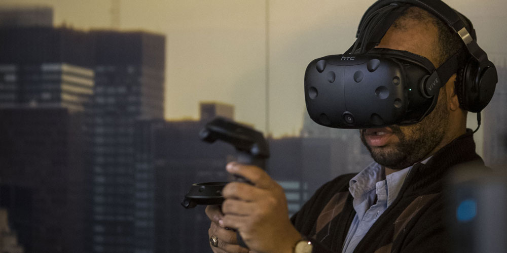 Man at Dell Experience at CES 2017 tries virtual reality gaming