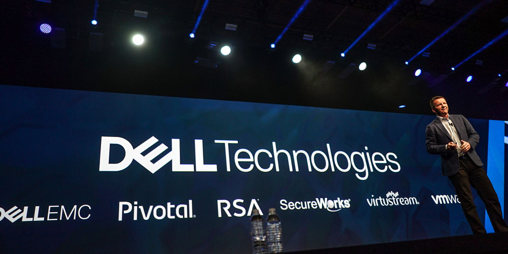 jeremy burton on stage with dell technologies brand logos behind him