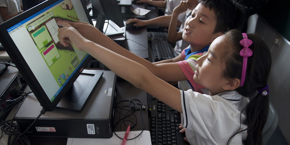 children in the REAP program using Dell computers