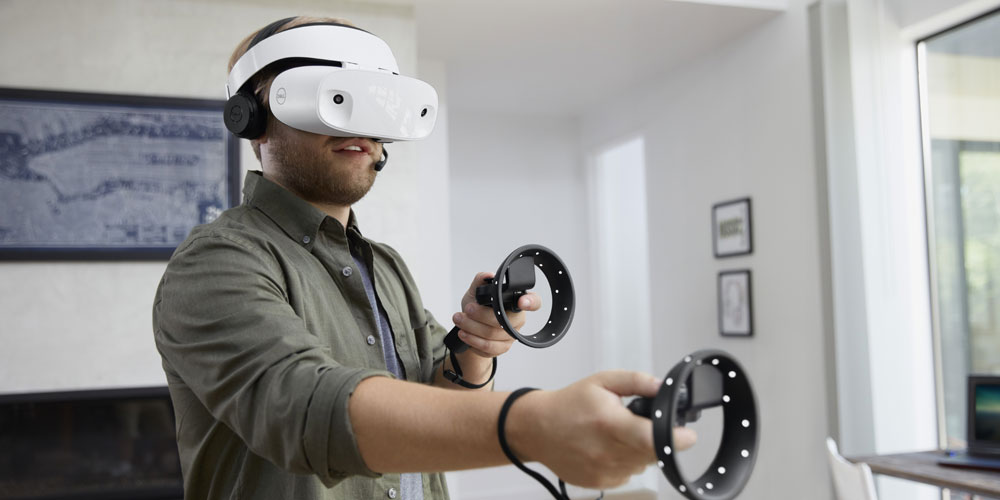 man wearing dell mixed virtual reality visor headset playing video game