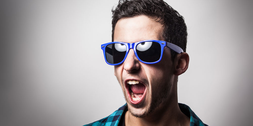 man wearing sunglasses with his mouth open in surprise