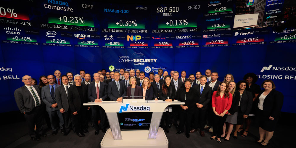 Group of people standing in Nasdaq office