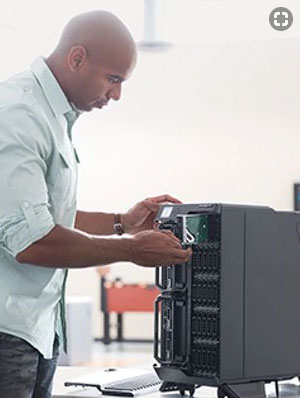 man adding components to Dell PowerEdge VRTX 