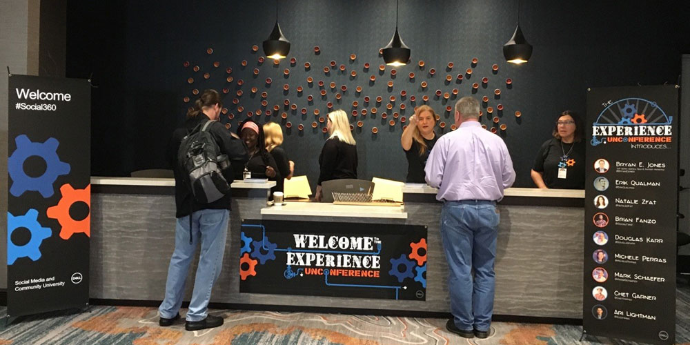people standing at registration desk for Dell unconference