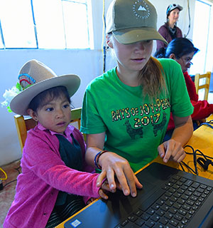 two girls working on a dell laptop