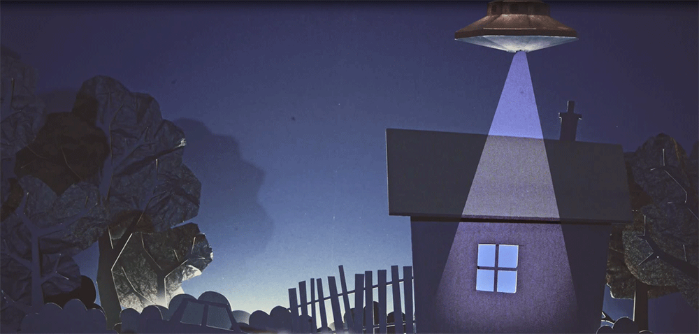 a UFO hovers over a house in still from stop motion animation short