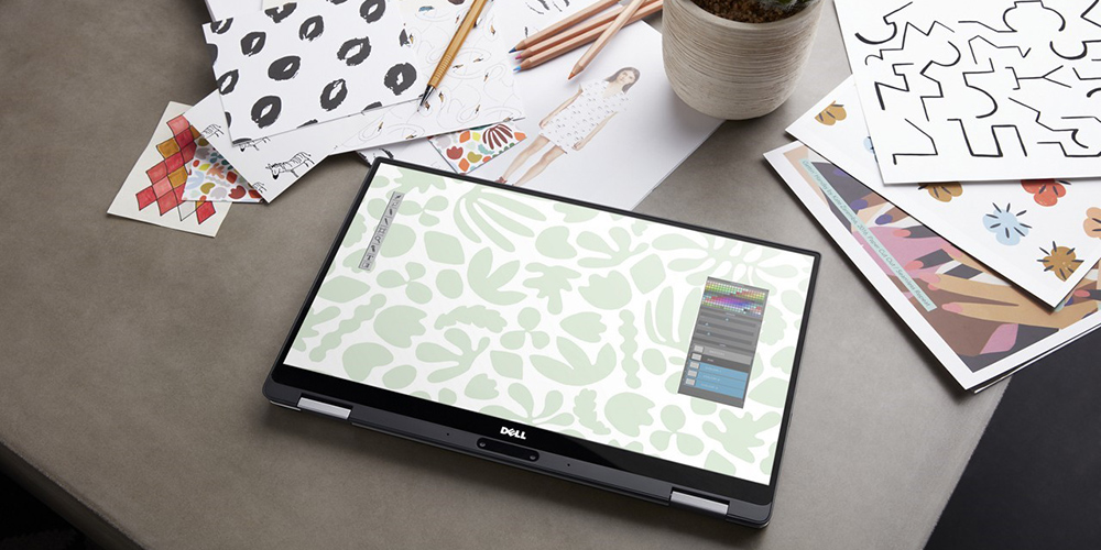 Dell XPS 13 2-in-1 laptop in tablet mode on a desk