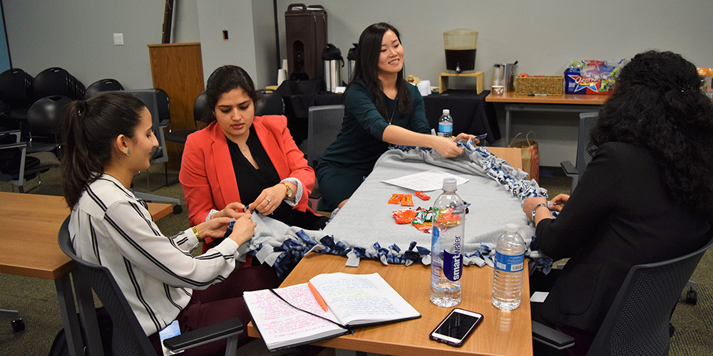 Dell HRRP participants making blankets for charity