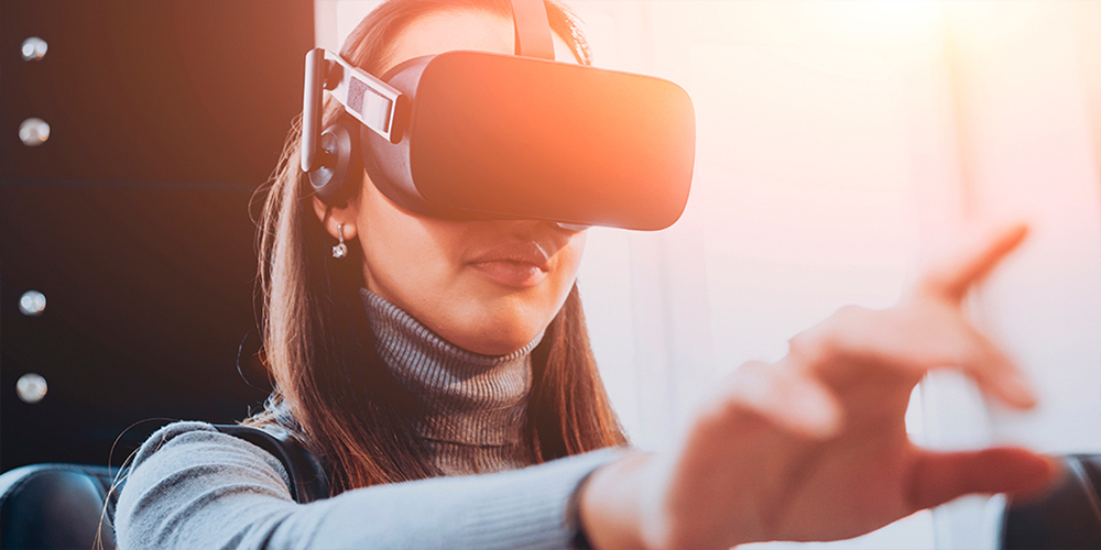 woman in a vr headset reaching out in front of her