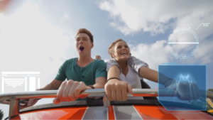 Man and woman enjoying a rollercoaster ride. 