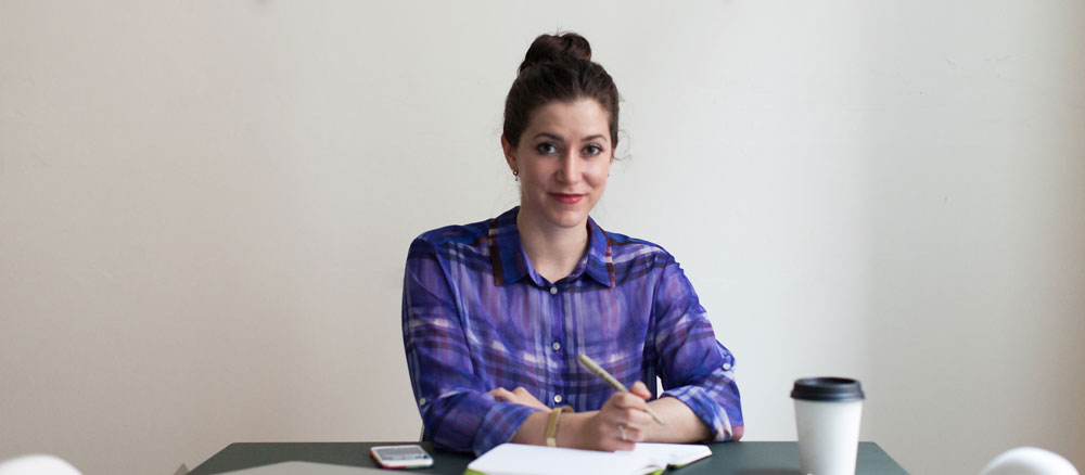 Sara Judd Welch sitting at a desk