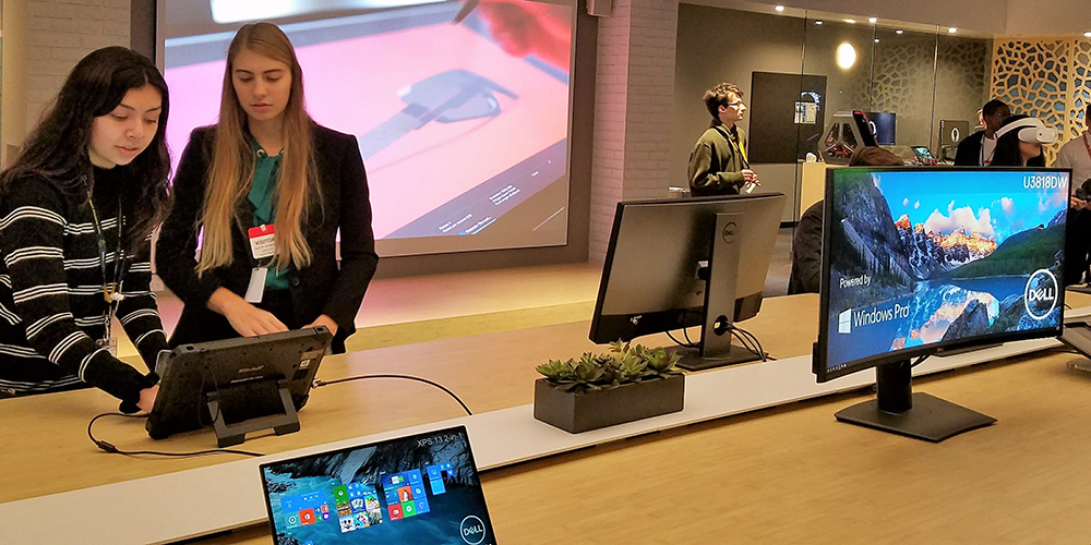 two high school students in the dell experience center on Dell's main campus