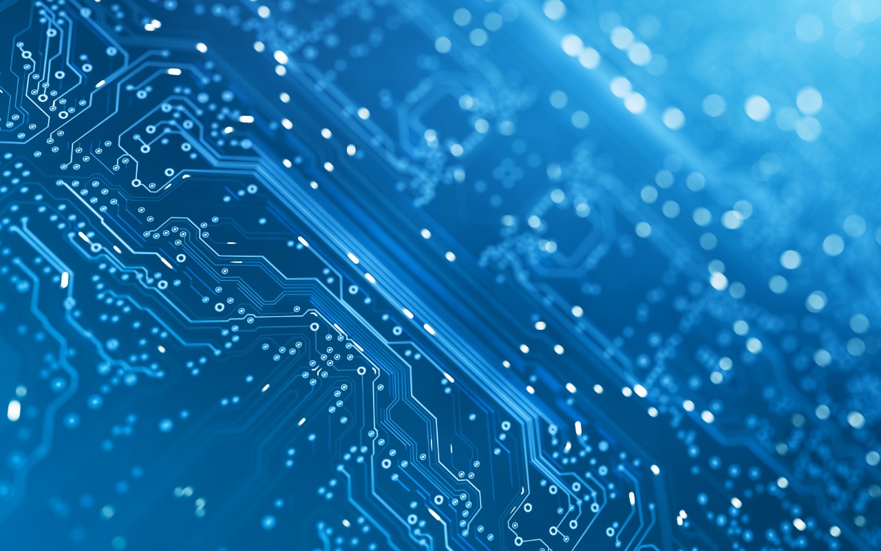 Computer circuit board in blue tint, indicating technology and artificial intelligence.