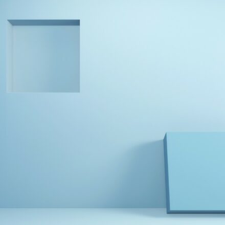 Square inset on pastel colored wall with matching portion resting on wall.