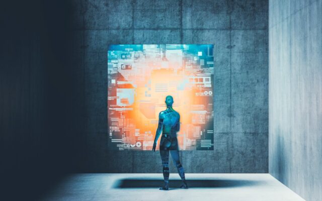 Cyborg or android looking at image on futuristic cube-shaped display.