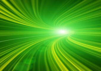Abstract image in green of light moving in high speed tunnel.