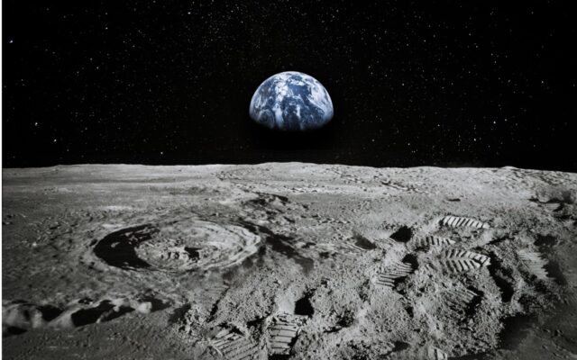 View of Earth from the Moon, with footprints in the lunar dust.