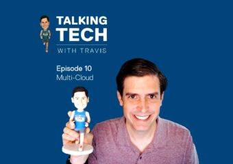 Travis Vigil holding his runner bobblehead against a blue background, with Talking Tech with Travis video series logo and episode number/title in upper left corner.