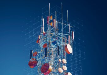 5G telecommunications tower with digitized connection points overlaid on the image.