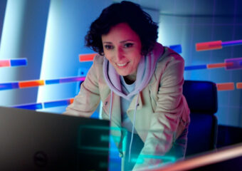 Female team member using a Dell Precision 5000 series notebook.
