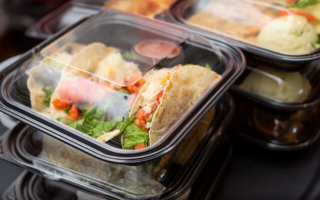 Restaurant delivery order in clear topy to-go containers.
