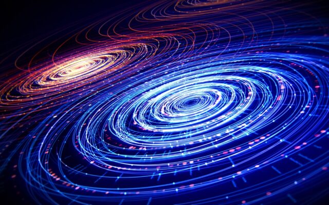 Digital abstract image of concentric circles, blue and white in foreground, pink/red in background, in motion.