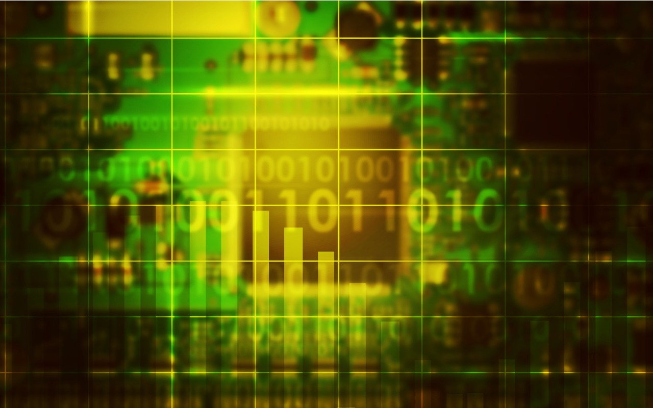 Abstract image with soft focus in green in yellow of electronics motherboard with binary code overlaid across the image.