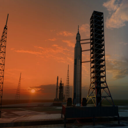 Rocket launch pads in low light as the sun is near the horizon in the background. Textured pattern is subtly overlaid the image..