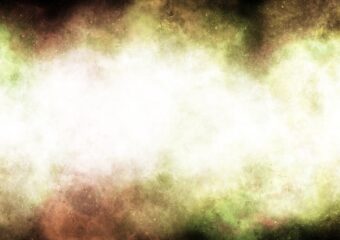 Abstract image of cloud of light colored gasses and matter in space against a starry background.