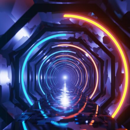 Futuristic tunnel lighted in different neon colors.