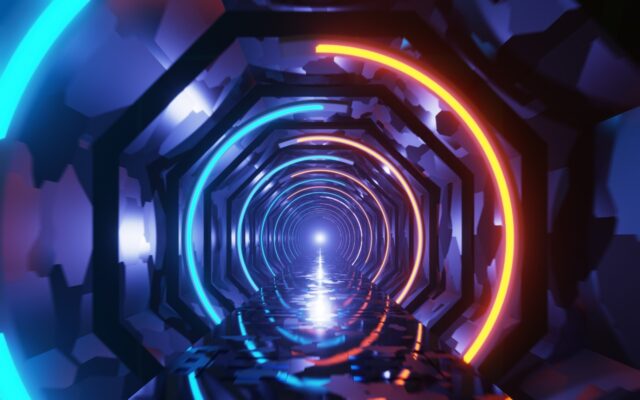Futuristic tunnel lighted in different neon colors.