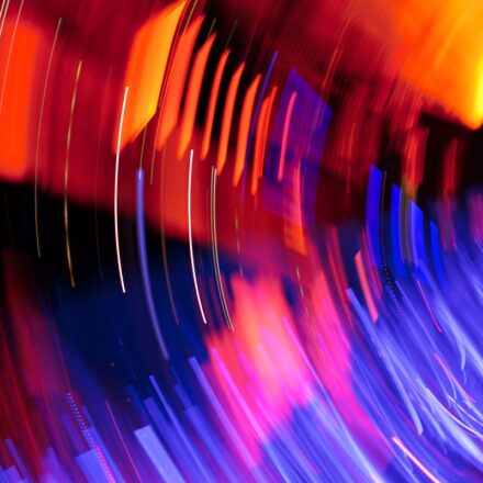 Image of an abstract lighting effect, revealing various shades of red, purple, blue, pink, and yellow.