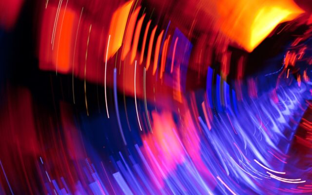 Image of an abstract lighting effect, revealing various shades of red, purple, blue, pink, and yellow.