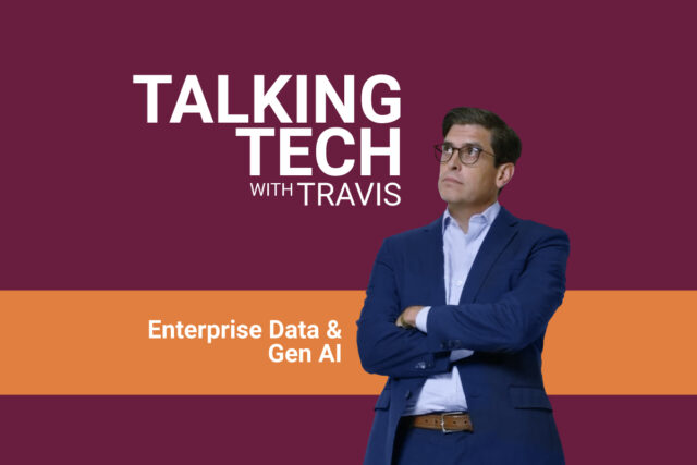 Title card for Talking Tech with Travis video episode, with Travis Vigil in a blue blazer and light blue shirt, standing in front of a maroon background with horizontal orange strip that includes episode topic.