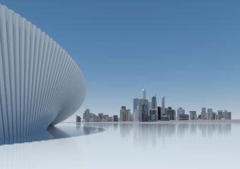 Digitally generated image of a virtual city skyline, with a silver ground surface and a blue skyline.